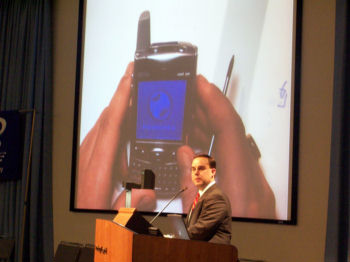Image: Jason J. Canty of Verizon Wireless demonstrates a PalmOne Treo for DACS members.